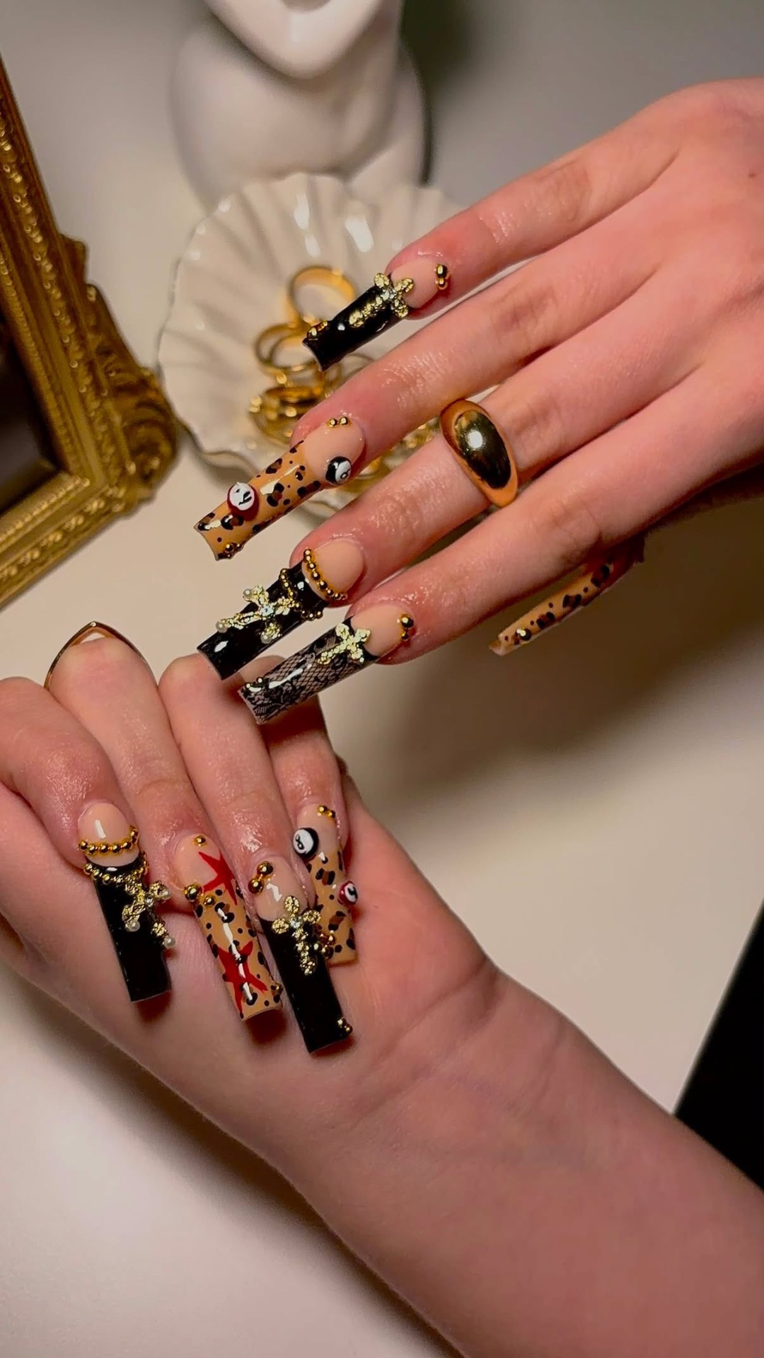 Xtra long leopard print Gel-X set with black cross charms and 8-ball art